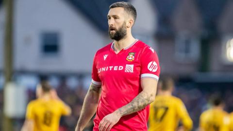 Wrexham forward Ollie Palmer looks on