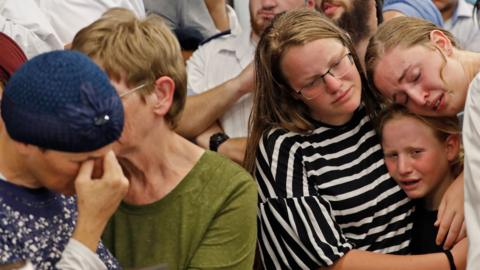 The mother (left) and family of Rina Shnerb mourn at her funeral in the Israeli town of Lod (23 August 2019)