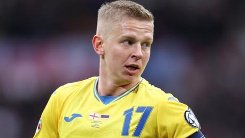 Oleksandr Zinchenko playing for Ukraine against England