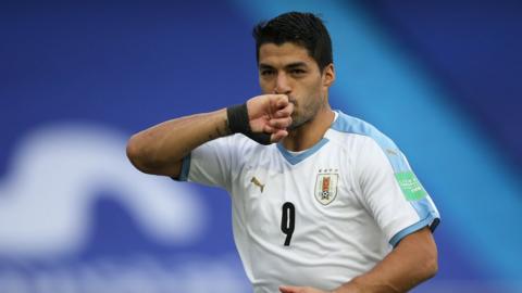 Luis Suarez celebrates scoring a goal