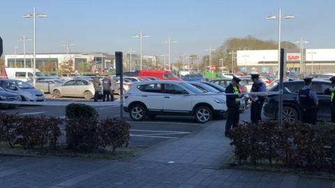Gardaí (Irish police) at the scene of the shooting at the M1 Retail Park in Drogheda
