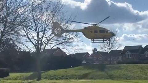 An air ambulance landing at Kesgrave, Suffolk, on 9 March 2021