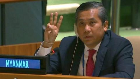 Myanmar"s ambassador to the United Nations Kyaw Moe Tun holds up three fingers at the end of his speech