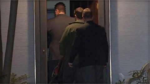 FBI agents entering Kaan Sercan Damlarkay's house