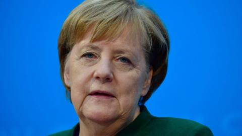 German Chancellor Angela Merkel gives a press conference on 27 November