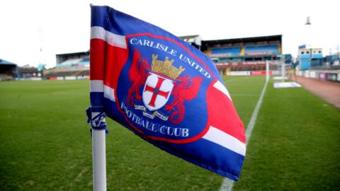 Carlisle badge on a corner flag at Brunton Park