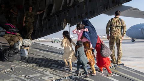 Afghans boarding a plane at Kabul airport