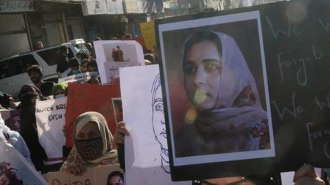 Supporters of Baloch political activist Karima Baloch hold her pictures during a rally to mourn her killing, in Quetta, the provincial capital of Balochistan province, Pakistan, 23 December 2020.