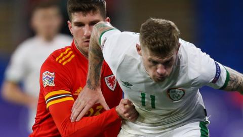 Republic of Ireland's James McClean (right) challenges Chris Mepham of Wales