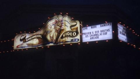 Photograph shows the Showgirl sign lit up