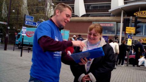 A charity collector in Stratford