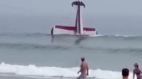 Small plane floats nose-down in the water