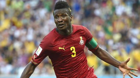 Asamoah Gyan spreads his arms to celebrate scoring for Ghana