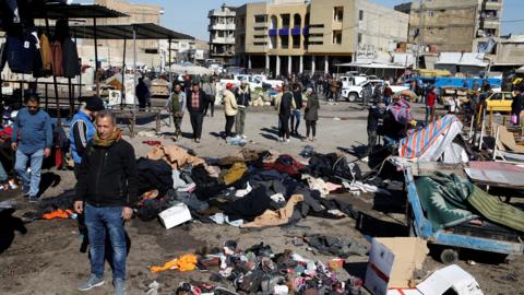 Aftermath of a suicide bomb attack at an market in central Baghdad on 21 January 2021