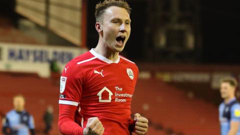 Cauley Woodrow celebrates scoring a penalty for Barnsley against Wycombe