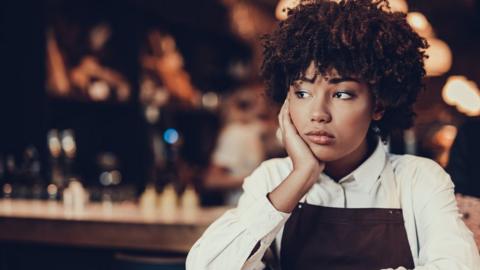 Waitress looking unhappy