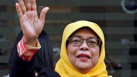 Former speaker of Singapore's parliament, Halimah Yacob, arrives at the Elections Department after she was given the certificate of eligibility to contest the election by the Presidential Elections Committee in Singapore 11 September 2017.