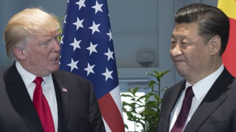 US President Donald Trump and Chinese President Xi Jinping (R) pose prior to a meeting on the sidelines of the G20 Summit in Hamburg, Germany, July 8, 2017.