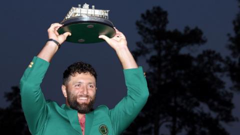 Jon Rahm with the Masters trophy and Green Jacket