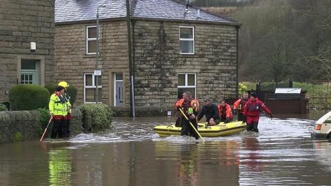 People being transported in a raft