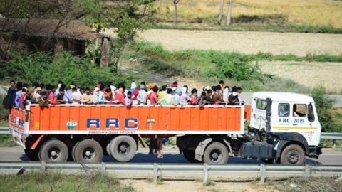 Lorry with people in back