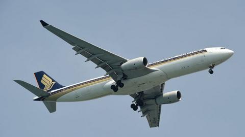 A Singapore Airlines Airbus 330-300 plane prepares to land at Changi International airport in Singapore on 8 April 2016.