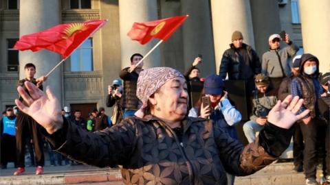 Supporters of Sadyr Japarov stand in a square outside the government house in Bishkek, Kyrgyzstan, 14 October 2020.