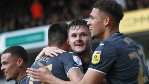 Liam Cullen celebrates his goal with his team-mates