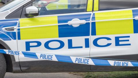 Police car and tape, stock image