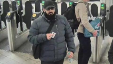 Khan passing through London Underground