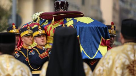 Soldiers carry the coffin of the late King Michael during a funeral ceremony in Bucharest, Romania, 16 December