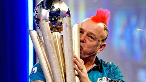 Peter Wright with the Sid Waddell Trophy after victory against Michael Smith