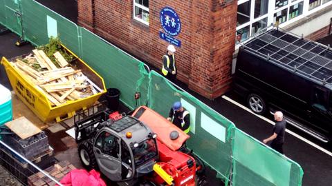 Workmen at Abbey Lane Primary School in Sheffield, on 1 September 2023