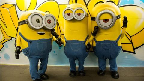 People wearing Minions suits