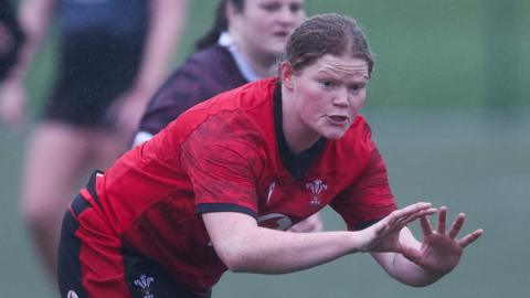 Tess Evans in Welsh rugby kit