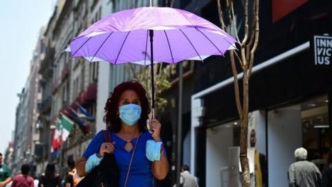 A tourist wears a face mask due to air pollution in Mexico City on 14 May, 2019.