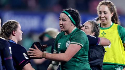 Ireland and Scotland players shake hands after their game in Belfast