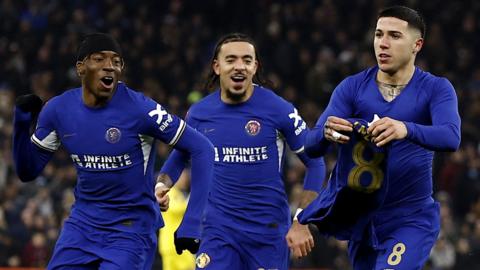 Chelsea's Enzo Fernandez celebrates scoring their third goal with Malo Gusto, Noni Madueke and Moises Caicedo