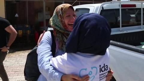 Rola Hallam greets doctor at Hope Hospital