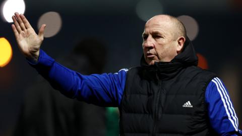 John Coleman, Manager of Accrington Stanley, acknowledges the fans after the Sky Bet League One between Port Vale and Accrington Stanley at Vale Park on February 07, 2023 in Burslem, England.