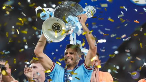 Rodri lifts Champions League trophy