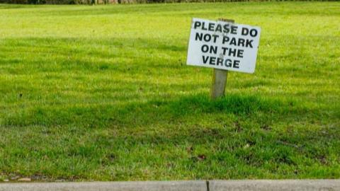 No verge parking sign