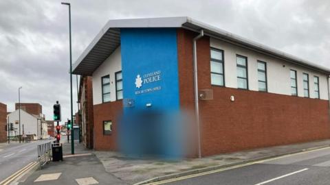 Redcar police station with graffiti blurred out