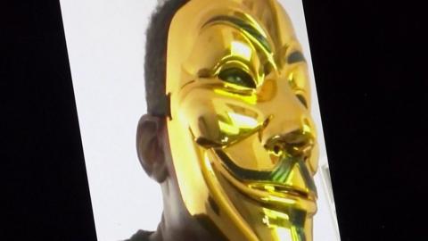 Rave organiser in a gold mask