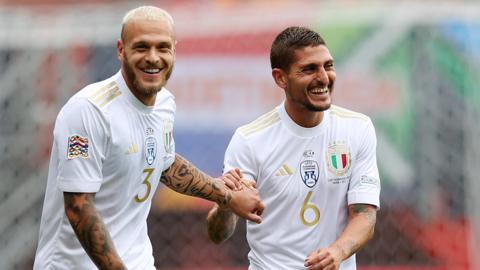 Italy celebrate their opening goal