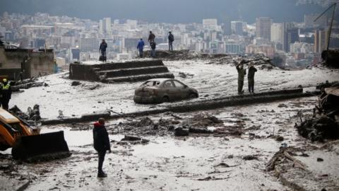 Residents and rescue crews search homes and streets covered by mud in Quito, Ecuador. Photo: 1 February 2022