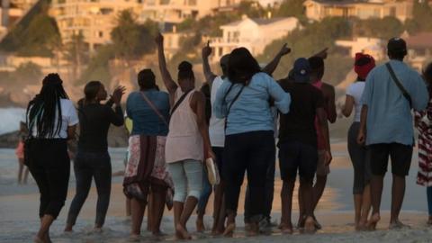 Protesters on Clifton beach