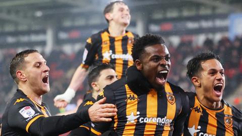 Noah Ohio of Hull City celebrates with team-mates after scoring his team's second goal at Rotherham