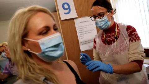 Vaccine being administered