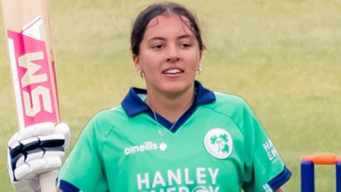 The Belfast schoolgirl acknowledges the applause after notching her century on Monday